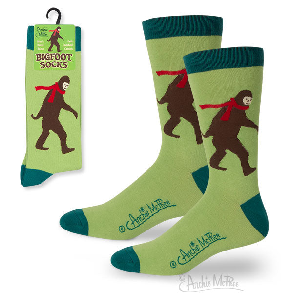 Explore our popular Bigfoot Socks, made from a cozy blend of combed cotton. These green socks boast a fun Bigfoot design adorned with red scarves, complemented by their striking packaging.