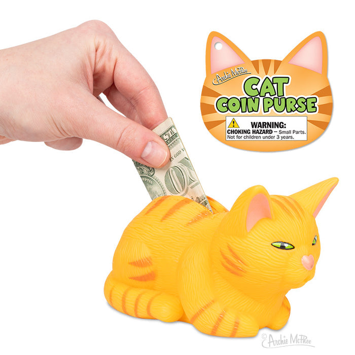 A hand inserts a dollar into the Orange Tabby Cat Coin Purse, ideal for cat lovers. The label, Orange Tabby Cat Coin Purse, perfectly captures feline enthusiasts charm.