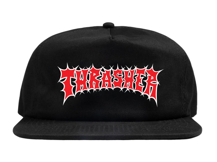 A black flat-brim snapback cap featuring the red and white Thrasher logo in a spiky metal font on the front, set against a light gray background.