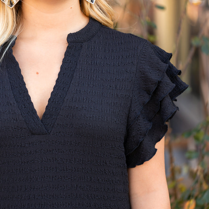 50020 - Solid Color Textured Dress with Ruffled Sleeves and Pockets - Black