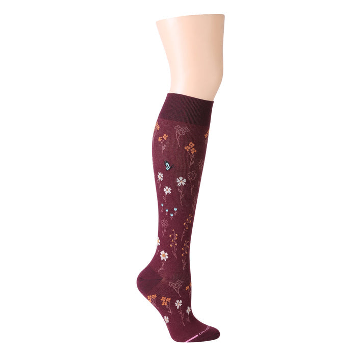 Knee-high maroon compression socks with floral and butterfly patterns.