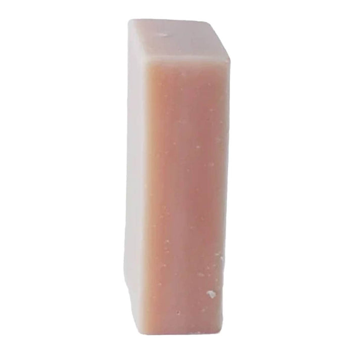 Rectangular pinkish bar of rose geranium soap on a white background