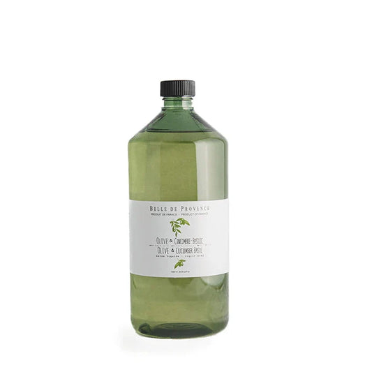 A clear bottle of Belle de Provence liquid soap with a label that includes the product name and a picture of olive leaves.