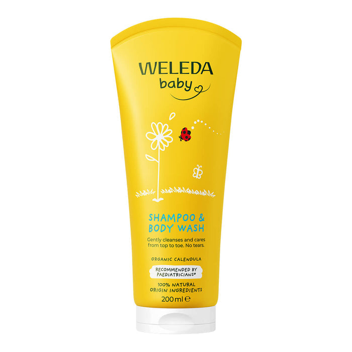 Yellow Weleda baby shampoo and body wash tube on a white background