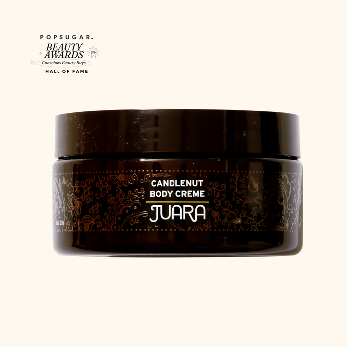 Jar of JUARA Candlenut Body Creme on a white background.