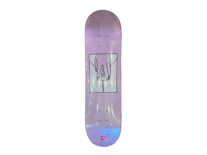 A lavender purple skateboard deck with a central graphic of hands holding a small figure, displayed vertically on a textured olive green background.