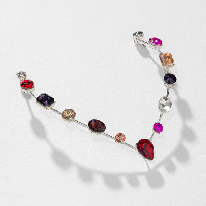 Necklace with multicolored gemstones on a white background