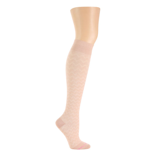 Knee-high compression sock in a light pink color with a chevron pattern and a solid cuff.