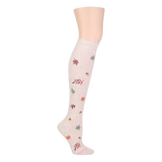 Knee-high compression socks in a light color with a fall foliage pattern featuring various leaves.