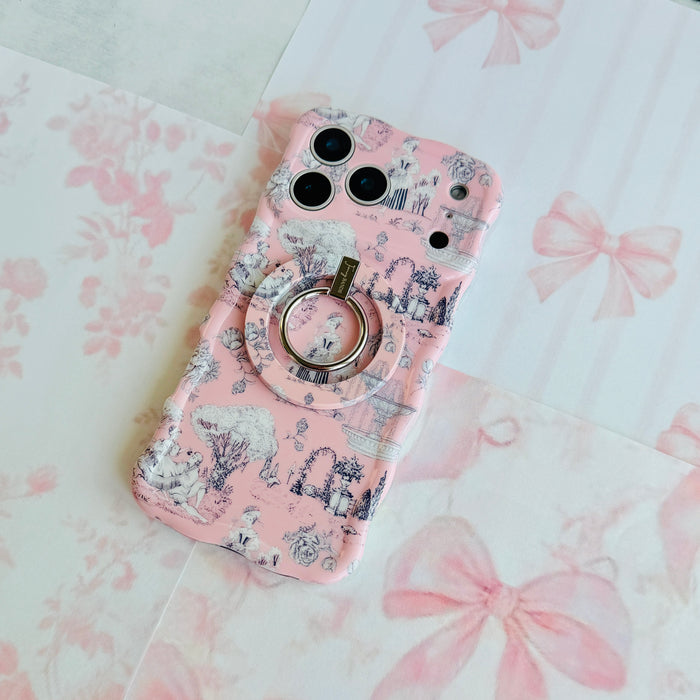 French Affair Wavy Luxe iPhone case with the matching MagSafe grip ring attached, styled on a pale pink bow print backdrop.