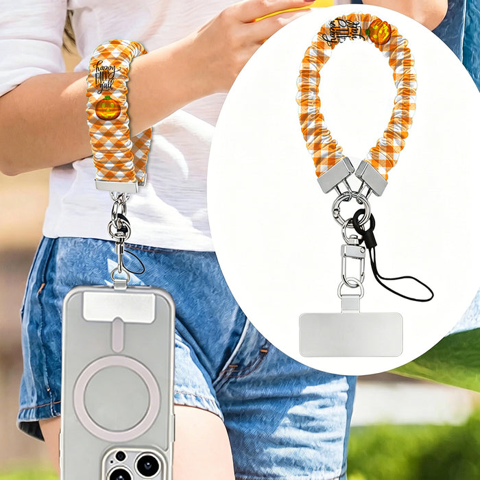 Happy Fall Y'all orange gingham and pumpkin scrunchie phone wrist strap from Fancy Bands
