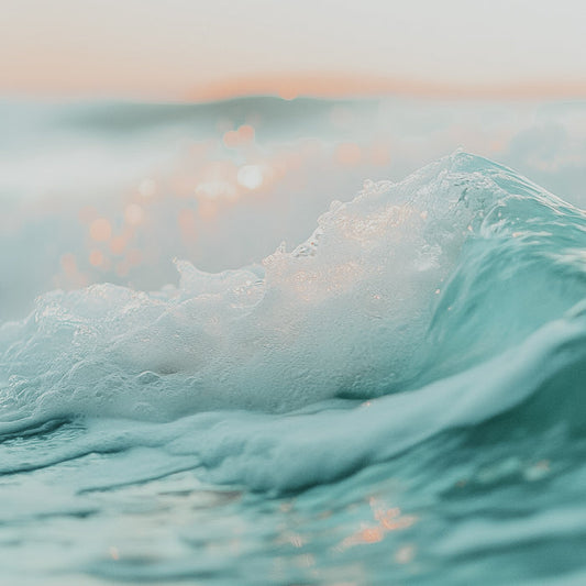 A close-up image of ocean waves with a serene coastal breeze theme.
