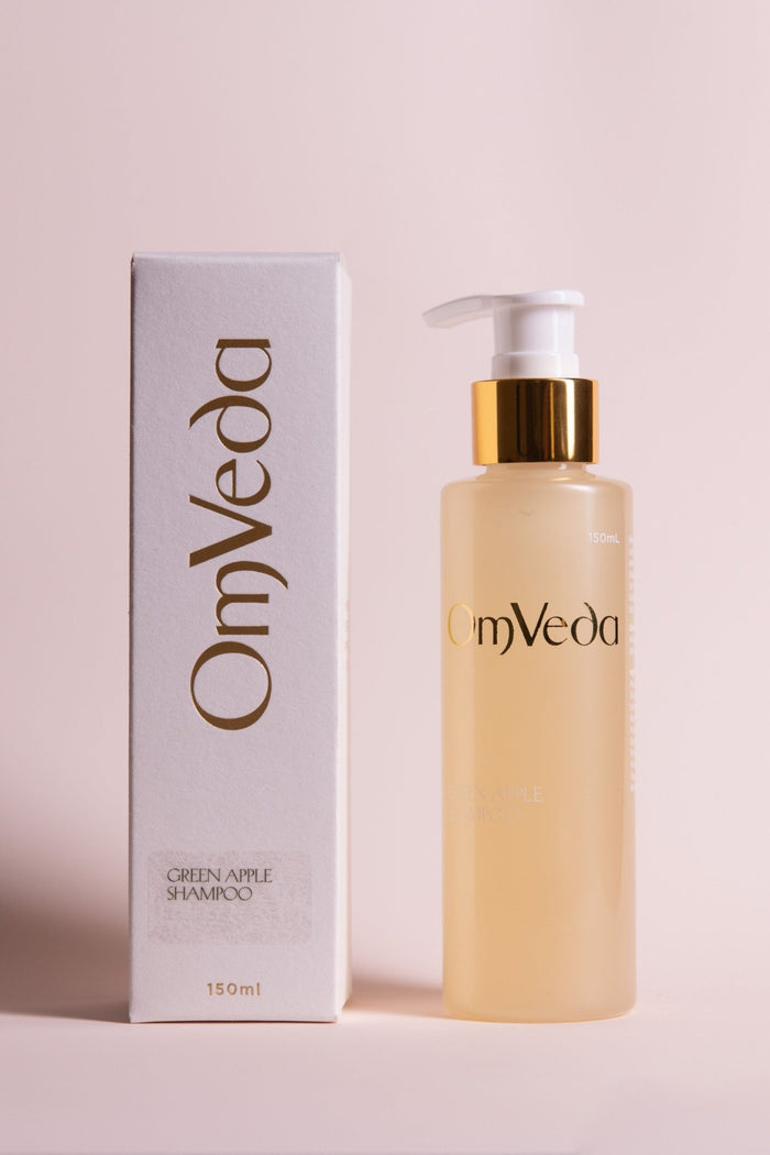 OmVeda Green Apple Shampoo bottle with gold pump and matching product box