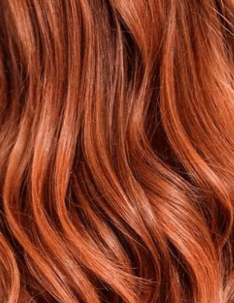 OmVeda herbal hair colour, spiced cider copper red strands, close-up wavy hair