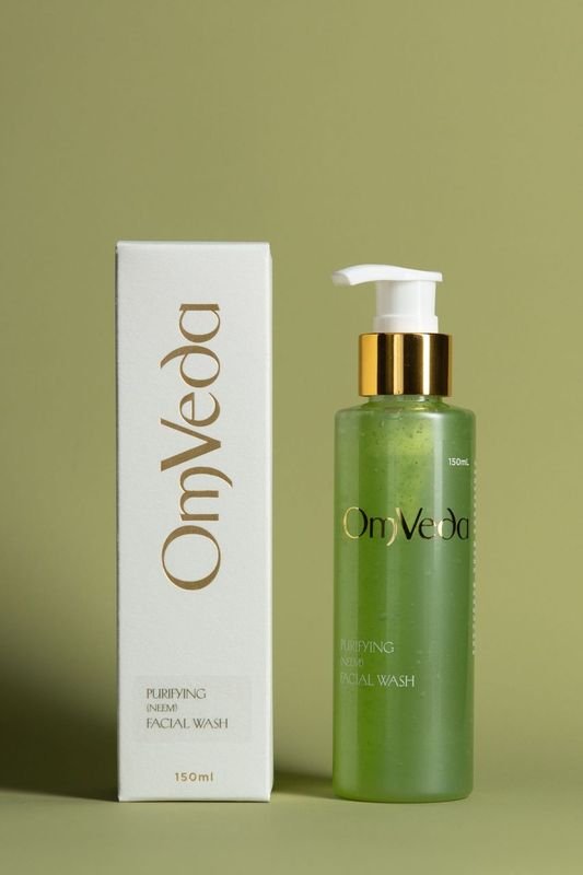OmVeda purifying neem facial wash, 150 ml, green bottle with gold pump and box