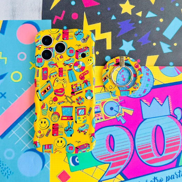 Oops It's the 90's retro pop art MagSafe phone grip ring with yellow background and colorful drawings of cassette players puzzle cubes and brick phones compatible with iPhone and Samsung