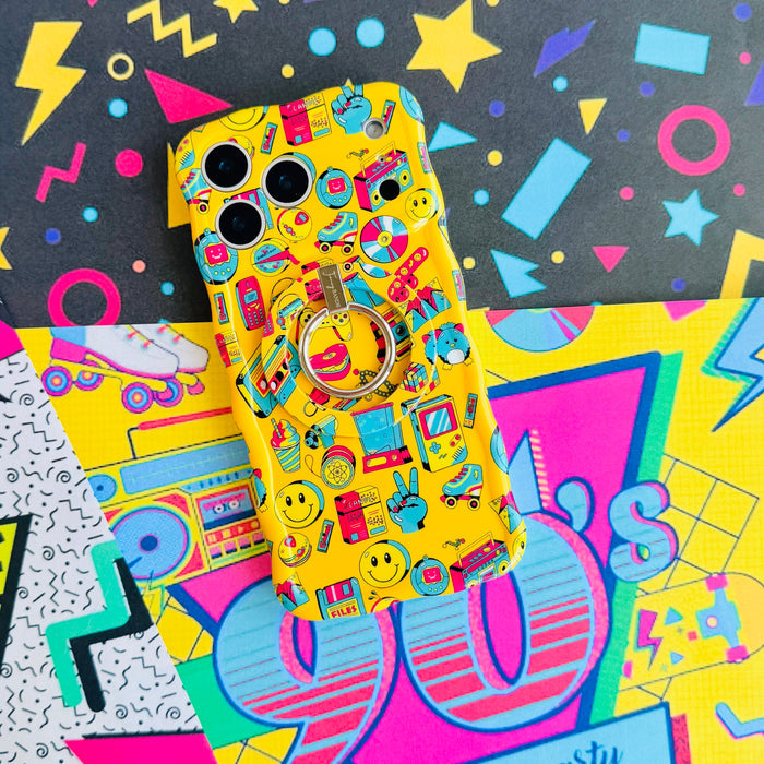 Oops It's the 90's retro pop art MagSafe phone grip ring with yellow background and colorful drawings of cassette players puzzle cubes and brick phones compatible with iPhone and Samsung