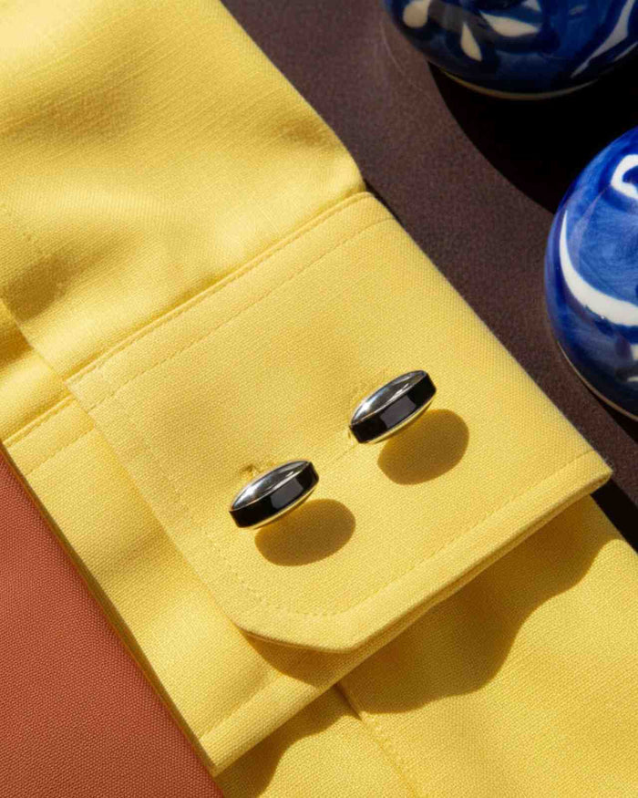 Premsons® black gloss half-moon curve cufflinks on a yellow shirt cuff