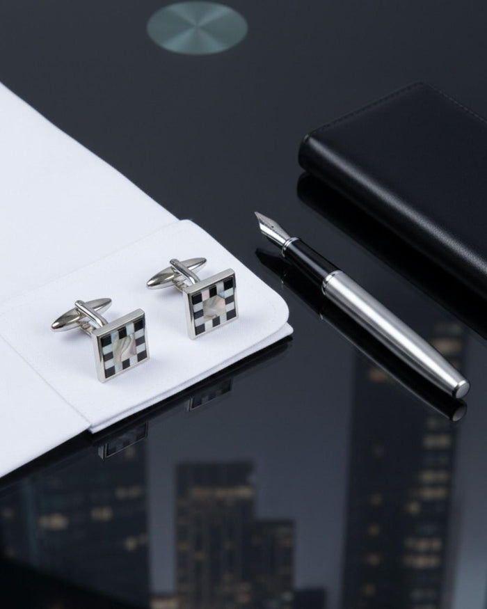 Silver cufflinks with square checkerboard mother-of-pearl panels and bar backs