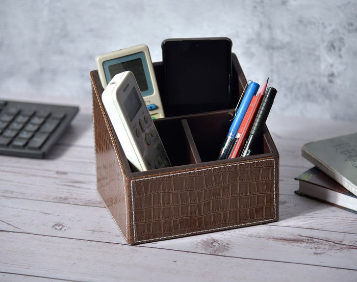 Brown croc-texture 3-compartment remote holder with dividers, holding remotes and pens