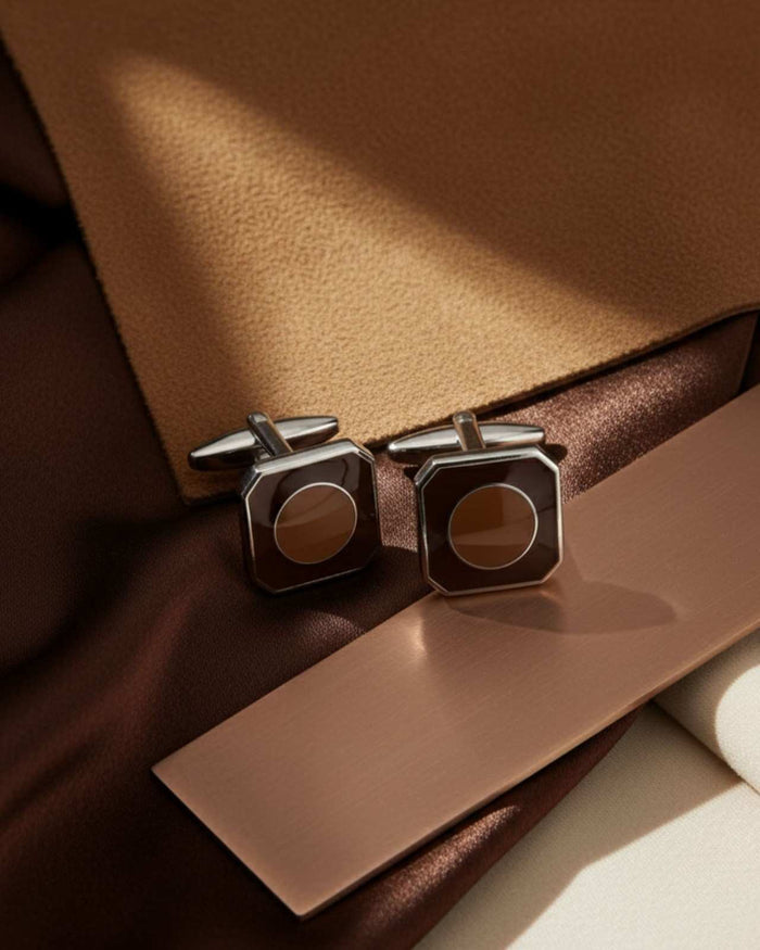 Octagon silver cufflinks with brown circular inlay, worn on shirt cuff
