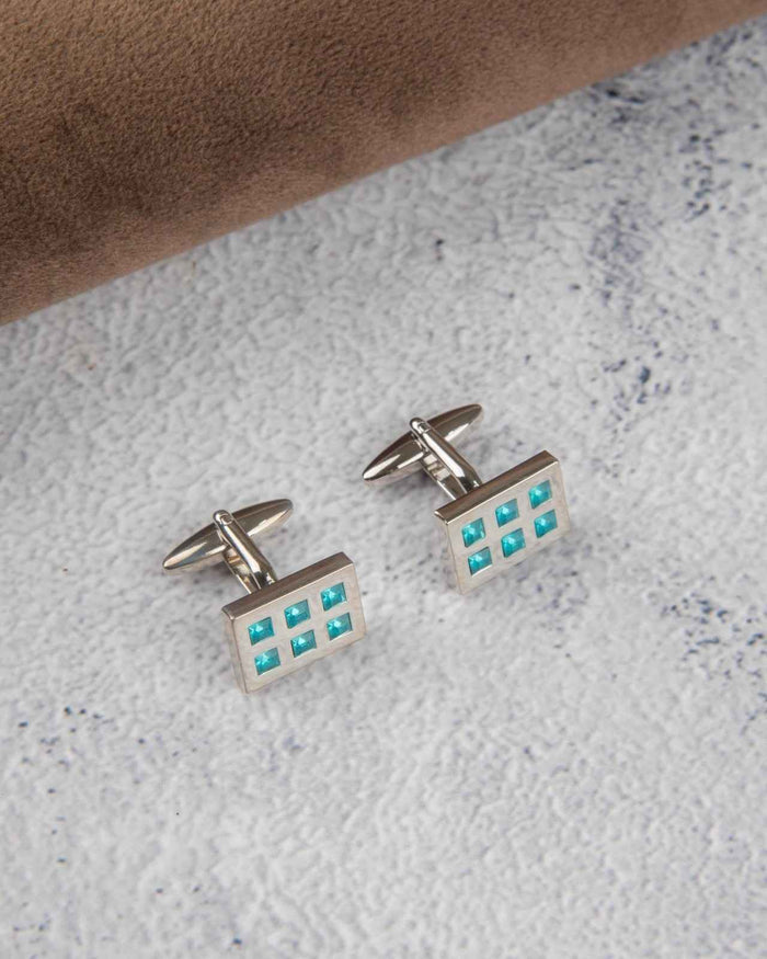 Rectangular silver cufflinks with aqua crystal grid inlay, close-up