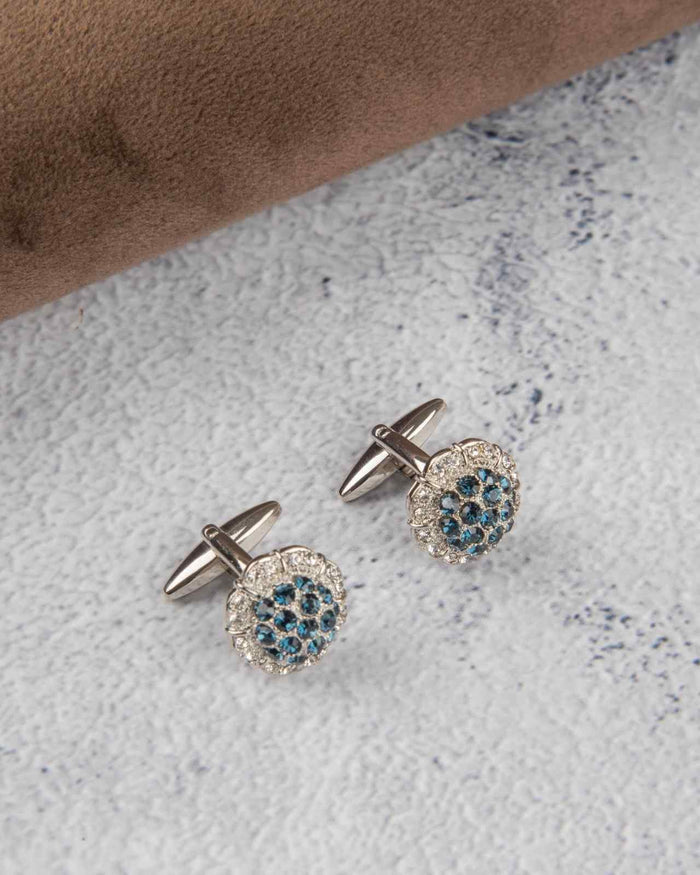 Round silver cufflinks with blue crystal cluster in a crystal-studded bezel