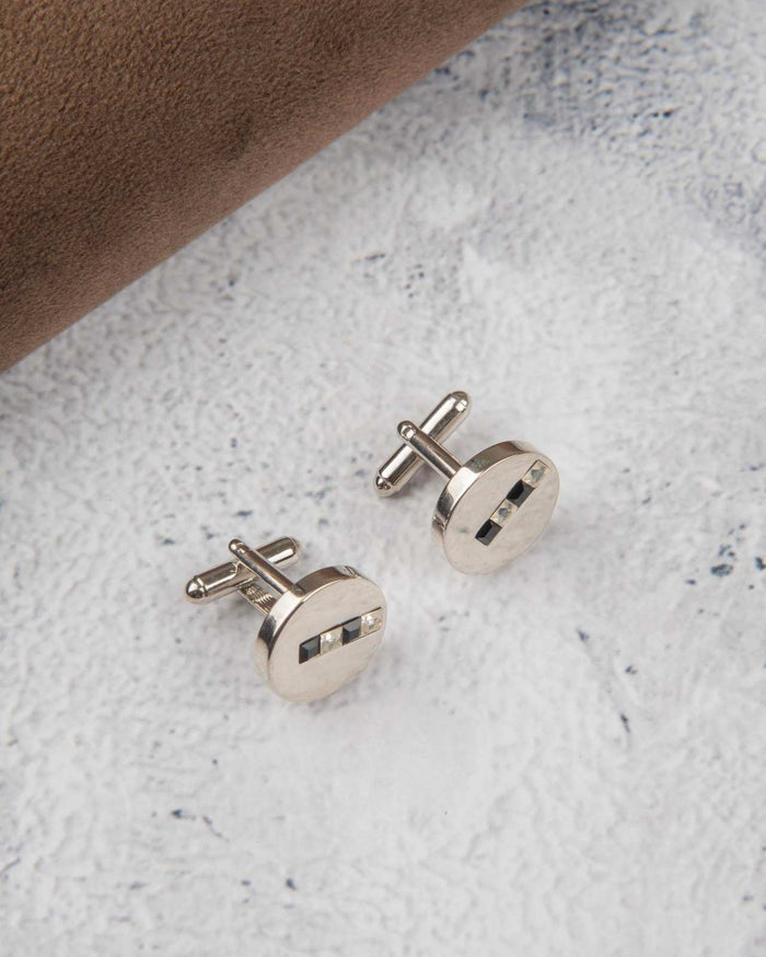 Round silver-tone stainless steel cufflinks with crystal inlets, pair