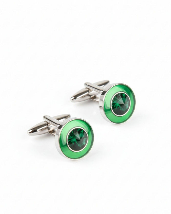 Round silver cufflinks with green center stone and emerald-look bezel