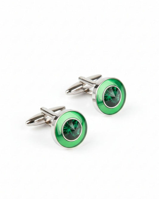 Round silver cufflinks with green center stone and emerald-look bezel