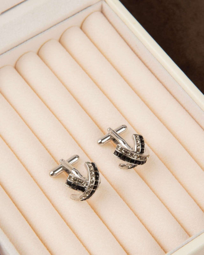 Silver arched cufflinks with black center stripe and crystal details, pair
