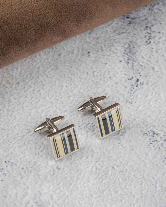 Square silver cufflinks with blue and cream striped resin inlay, side view