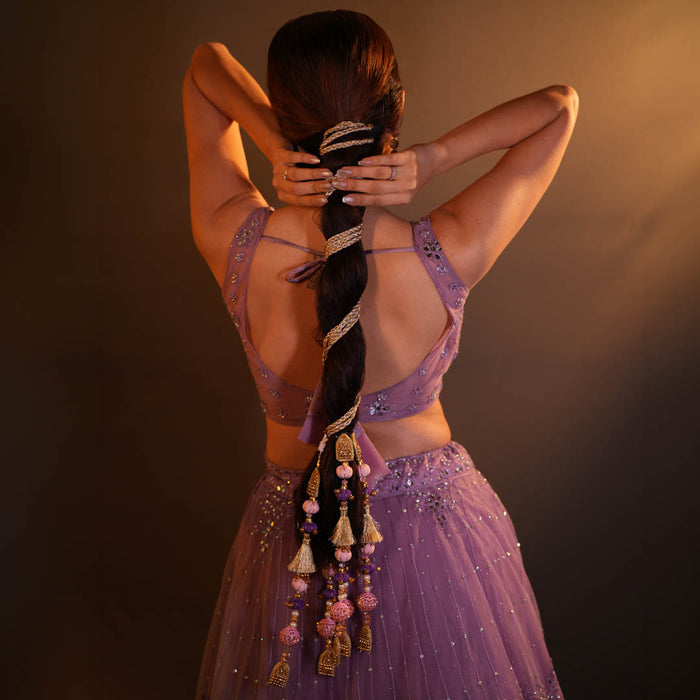 Pink, purple and gold parandi featuring crochet balls, crystals and pearl detailing