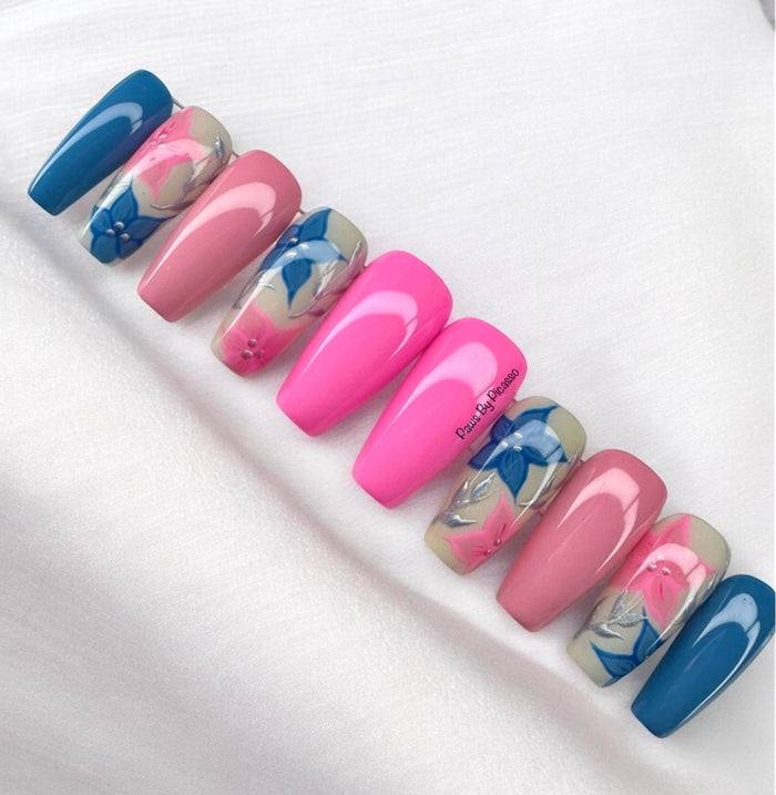 Set of pink and blue nail designs on a white background