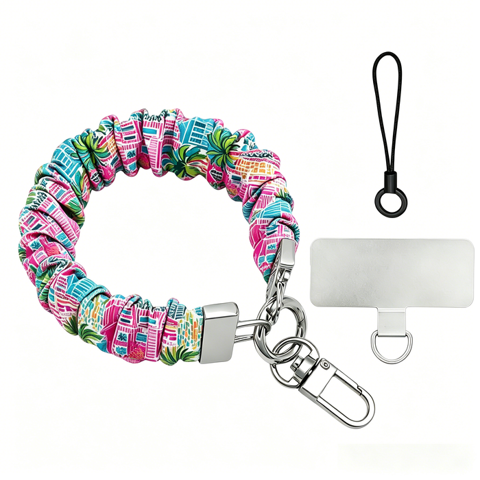 A stretchy scrunchie-style phone wrist strap with a metal clasp and phone tether tab, shown worn on the wrist and attached to a phone.