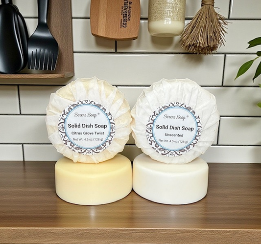 Two solid dish soap bars on a kitchen counter with labels.