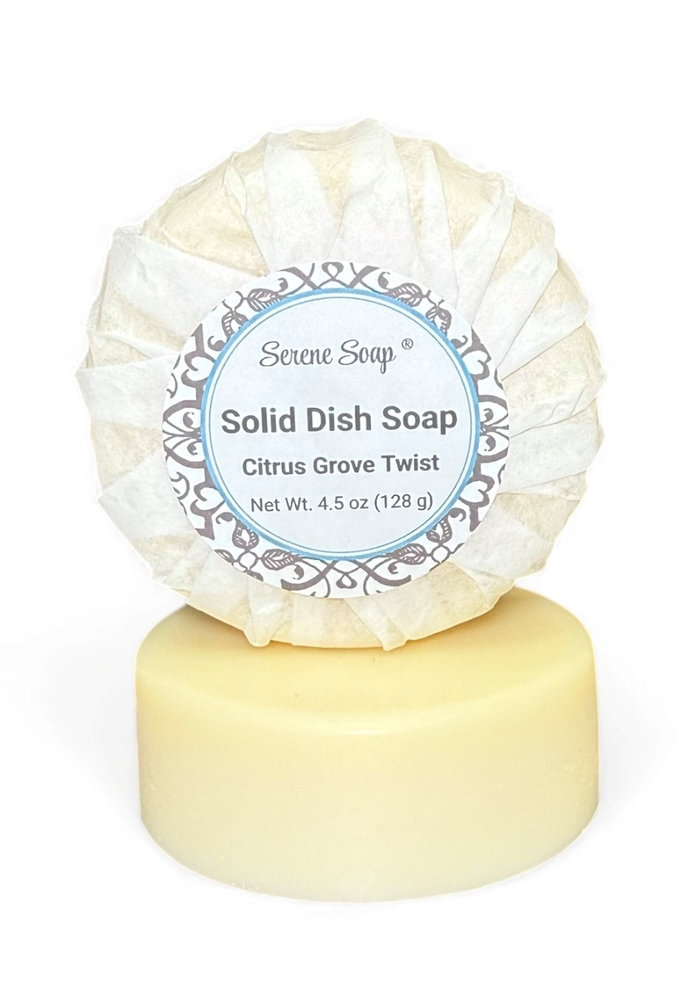 Solid dish soap bar with a label on a white background. This dish soap is scented.