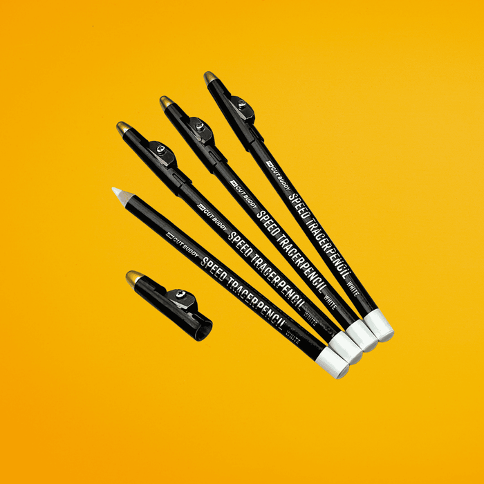 A set of four black Speed Tracer Pencils with white tips and integrated sharpeners, isolated on a yellow background.