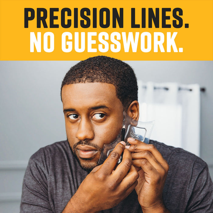 A man looking into a mirror while using a clear grooming stencil and a tracer pencil to define his beard line without guesswork.