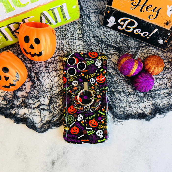 Spooky Wavy Luxe MagSafe iPhone case with the matching MagSafe grip ring attached, styled with orange pails and purple felt pumpkins.