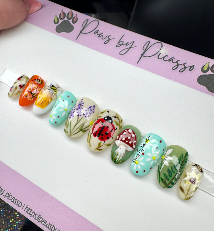 Decorative nail art set on a 'Paws by Picasso' branded card.