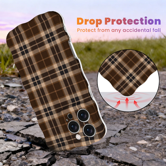 Drop protection diagram for the Toffee Tartan Wavy Luxe iPhone case, showing the shock-absorbing raised edges that protect the brown tartan print against accidental falls.